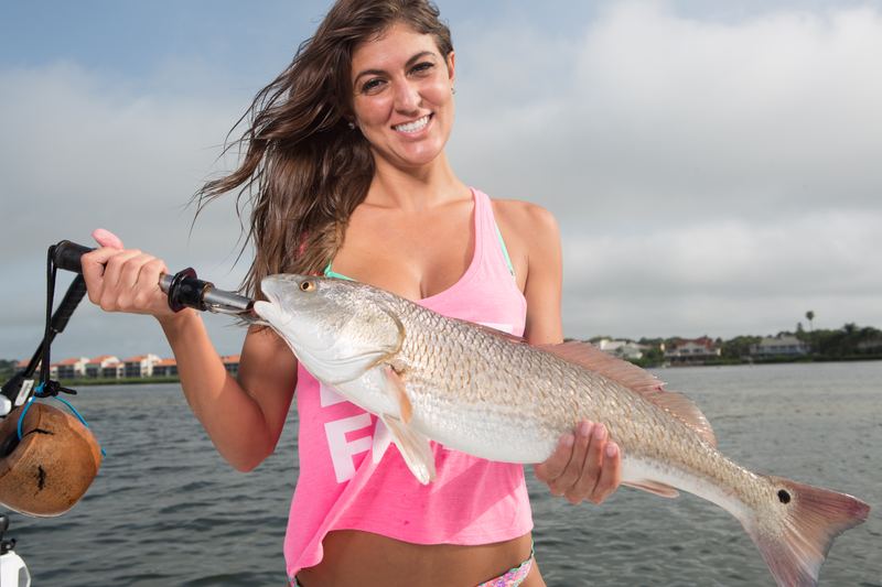 A Sarasota angler with a big redfish sight-fished off the flats, copper flanks and tail spot