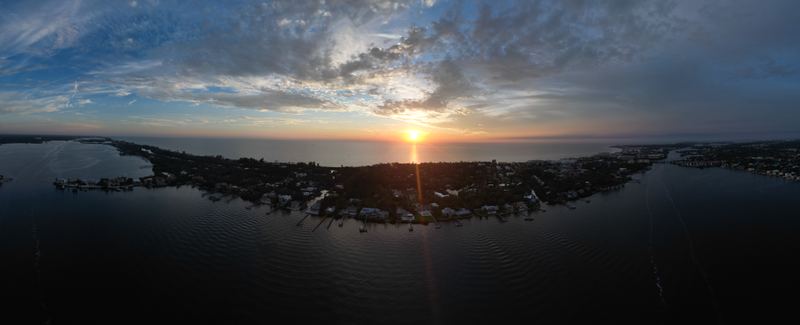 Aerial view of Siesta Key at sunset, with Big Sarasota Pass at the island's north end