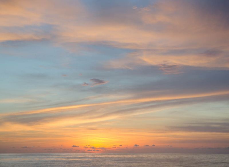 Dawn sky over Sarasota Bay — why the earliest bait shops open by 6 AM