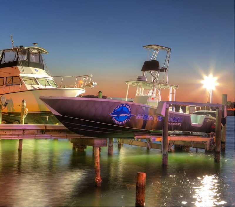 Boats staged at the docks near a Sarasota-area boat ramp at dusk