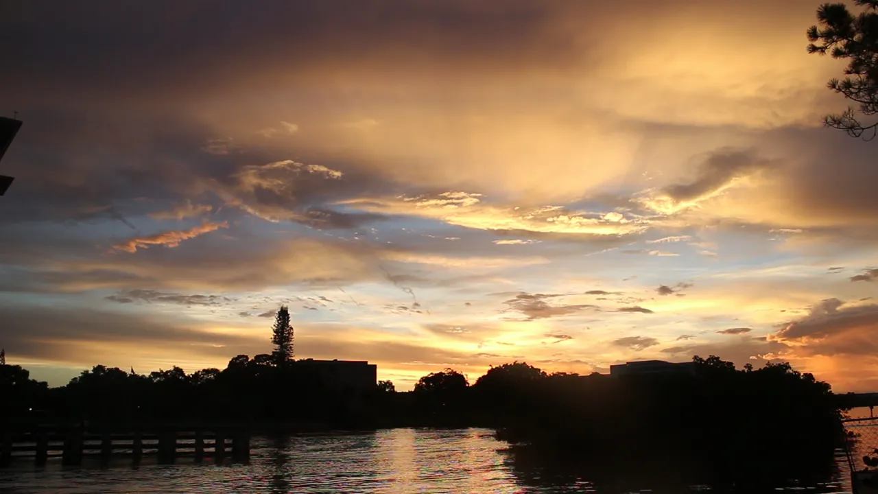 The afterglow outlasts the sunset — the boat lingers for the ride home.